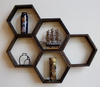 China Storage Hexagon Interior Decorator Honeycomb Wall Shelf Mounted Shelves for sale