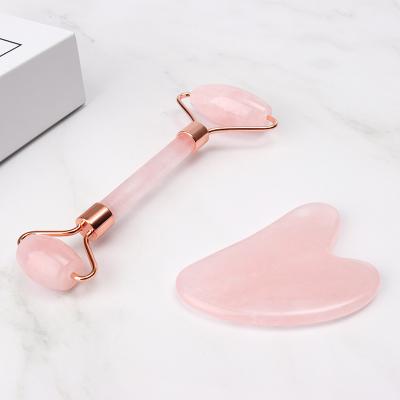 China Amazon Portable Hot Sale Natural Unwelded Stamping Pink Rose Quartz Facial Jade Roller for Face Massage for sale