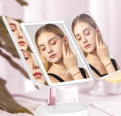 China Women's Gift 1x 2X 3X Magnification LED Makeup Mirror Customized Touch Control Portable Triple Vanity Mirror With Lights for sale