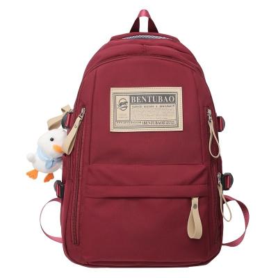 China New fashion school bag female college students high school girls backpack single large-capacity load reduction for sale