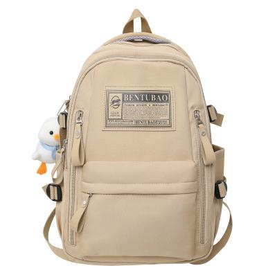 China Korean campus fashion trend schoolbag women's version backpack letter backpack large capacity soft campus men's backpack for sale