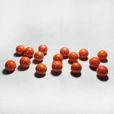 China Customized round solid glass balls of orange and milk glass marbles for sale 16mm for sale