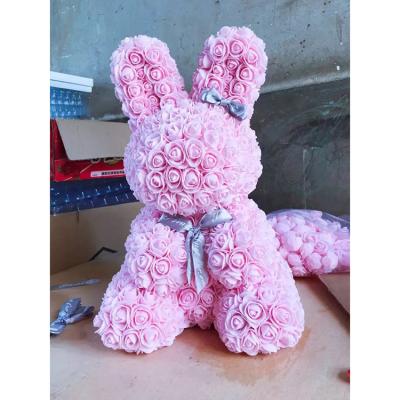 China Plush Artificial Pink Flower Celebrated Party Lover Gift Rabbit Toy Easter Bunny for sale