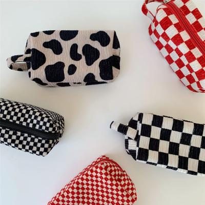 China Eco-friendly Women Portable Travel Bag Vintage Plaid Plaid Cosmetic Bag Cow Print Black White Checkerboard Cosmetic Bag for sale