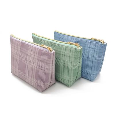 China Eco-friendly Simple British Style Dumpling Shape Travel Bag Large Capacity PU Cosmetic Storage Bag for sale