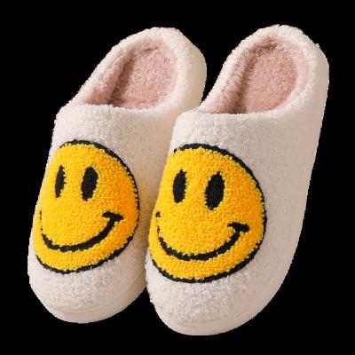 China Non - slipping hotsale smiley slippers smile logo unisex socks set happy face winter warm slips slippers cute children sandals home woman for sale