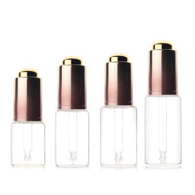 China 10ml 15ml 20ml 25ml 30ml 50ml Luxury Glass Bottles Rose Gold Gradient Pressing Essence Recyclable Liquid Essential Oil Dropper Bottles for sale