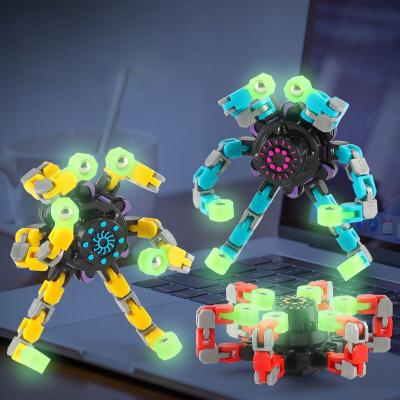 China Plastic Mechanical Deformable Fingertip Spinning Toy Transformable Creative Gyro Toy Trigger Fingertip Spinner DIY Luminous Top for sale