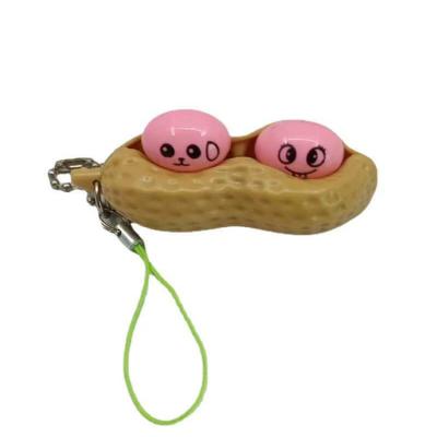 China Soft Silicone Decompression Toy Peanut Key Chain Extrusion Soybean Keychain Silicone Squeeze Toy for sale