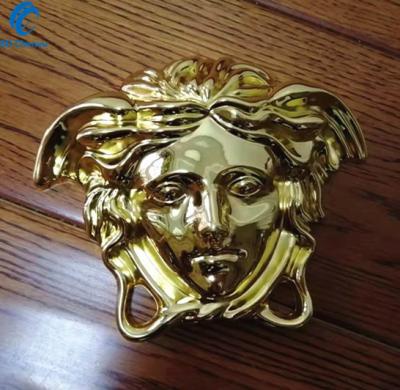 China Large modern gold alloy jellyfish face wholesale emblem for furniture accessories for sale