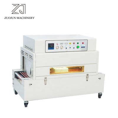 China Desktop Type Shrink Packing Machine Automatic Small Plastic Film Shrink Wrapping Food Packaging Machine for sale