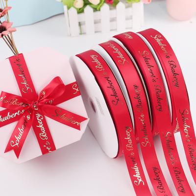 China Factory 20mm Metallic 100% Polyester Satin Ribbon Roll Festival Ribbon With Gold Foil Logo Gift Ribbon for sale