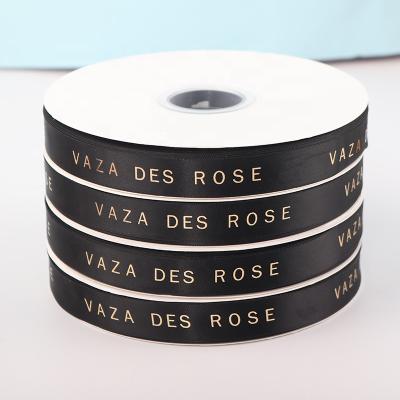 China Other Customized High Quality 100% Luxury Ribbons 1Inch Gold Foil Satin Thread Bronze English Gift Ribbon for sale