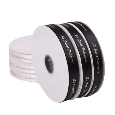 China Other New Arrival 2cm White Satin Ribbon Print With Logo Hot Stamping Gold Raised On Polyester Ribbon For Gift Wrapping for sale