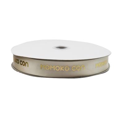 China Other 15mm 100% Polyester Double Face Ribbon Factories Printed Gold Foil With Logo On White Satin Ribbons For Packaging for sale