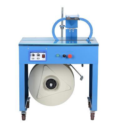 China Useful Aid In Work Low Stage Semi-automatic Strapping Machine PP Strap 5-40kg Tension Range 750mm Workingtable Height for sale