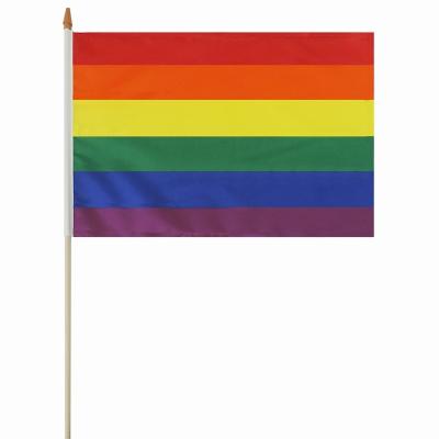 China Wholesale High Quality 100% Polyester FLYING Hand Waving Waving Flag Custom Design Durable Material 30*45cm Rainbow Hand Flag With Wooden Pole for sale