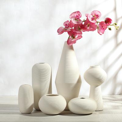 China Creative size simple modern minimalist white ceramic vase home furniture living room sweet floral arrangement for sale