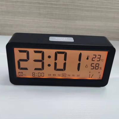 China LUMINOVA Multifunctional Smart Digital LCD Table Decorative Clock Three Alarm Clock Temperature and Humidity Backlight LCD Clock for sale