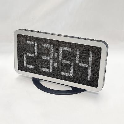 China LUMINOVA Fabric Covered Electronic Alarm Clock Snooze Luminance Table Automatically Sensitive Alarm Clock for sale