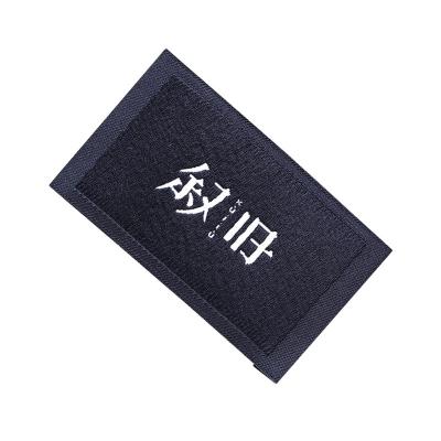 China Viable Private Custom Brand Logo Flag Woven Hem Label Label With Loop Center Fold for sale