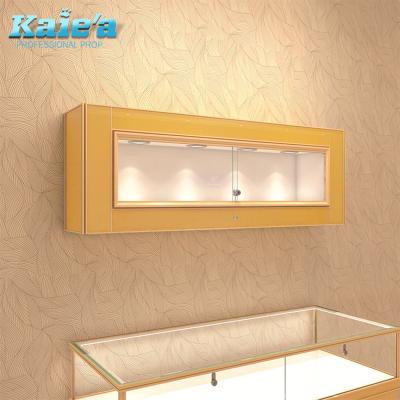 China Modern Wall Mounted Glass Jewelry Display Shop Showcase Gold With Led Lights for sale