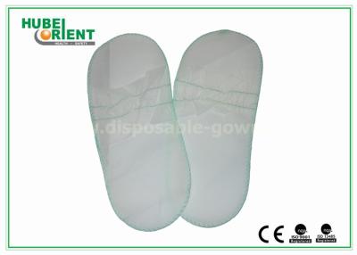 China Zapatos de pie de hombre / mujer desechables blancos elásticos para centros de belleza en venta