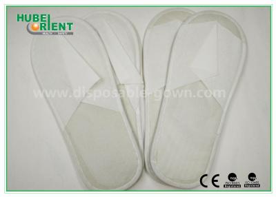 China Blanco zapatillas de hotel desechables / dedos cerrados de una sola vez usar zapatillas no tejidas sola EVA en venta