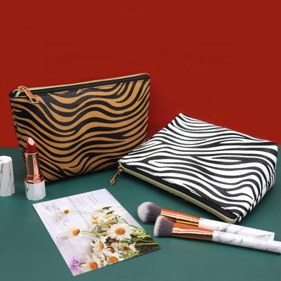 China Small Travel Makeup Brush Bag Logo PU Leather Cosmetic Bags Waterproof Cute Compact Portable Stand Pouch for sale