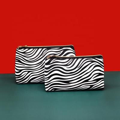 China Travel Waterproof Wholesale Makeup Pouch Toiletry Bag PU Gift Pencil Organizer Plain Zebra-stripe Design Cosmetic Bag for sale