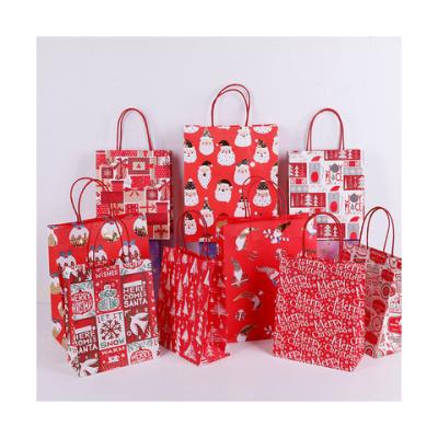 China New Materials Reused Portable Kraft Bags Beautiful Logo Christmas Decorations Gift Custom Paper Bags for sale