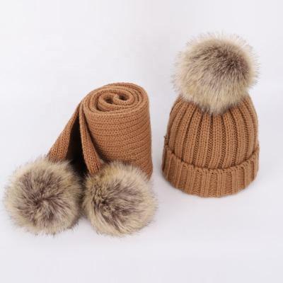 China COMMON Wholesale Winter Fashion Warm Christmas Kids Knitted Hats And Beanie Scarf With Faux Fur Protector Pom Ear Hats for sale