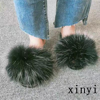 China Big Real Color Ball Shoes Fashion Trend Fox Pom Pom Fluffy Raccoon Sandals Flat Fur Slides For Women for sale