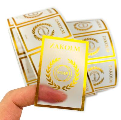 China Custom Printed Logo Packaging Vinyl Waterproof Transparent Gold Hot Label Printing Roll Stickers for sale