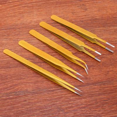 China Comfortable Straight Handle Stainless Steel Gold Wick Treated Pointed Tweezers For Eyelash Extension for sale