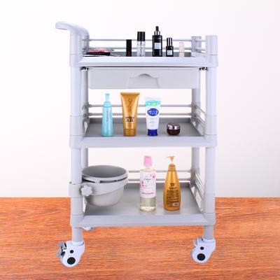 China Durable ABS Material Medical Plastic Beauty Salon Utility Trolley With Wheels for sale