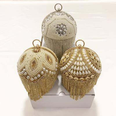 China New Fashion Style Pearl Bag Around Ring Handle Tassels Diamond Lattice Gold Basketball Bag for Woman Gold Tassels Bags for sale