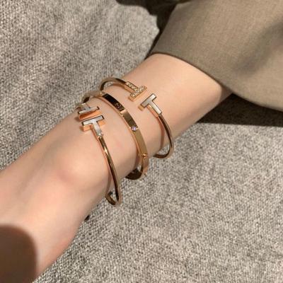 China Romantic hot luxury silver white fritillaria style s925 double t fritillaria diamond-encrusted bracelet ring drill couples rose gold double t opening for sale