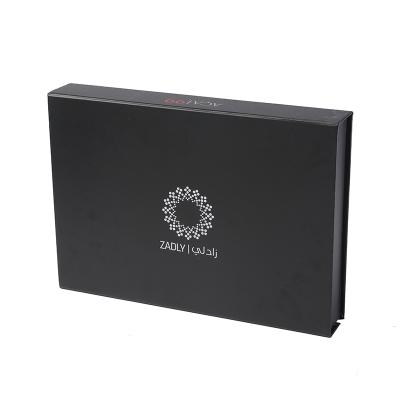 China Recyclable Custom Luxury Black Magnetic Lid Closure Folding Paper Clothing Packaging Boxes for sale