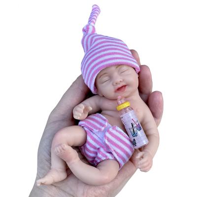 China 6 Inch Soft Full Solid Silicone Bebe Reborn Doll Handmade Cute Smiling Baby Toy for sale