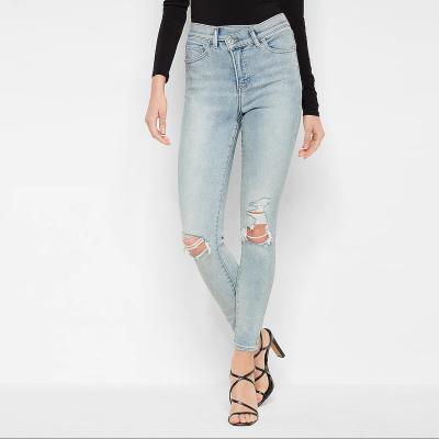 China 2022 Skinny Jeans Women Breathable High Waisted Crossover Belt Ripped Skinny Jeans for sale