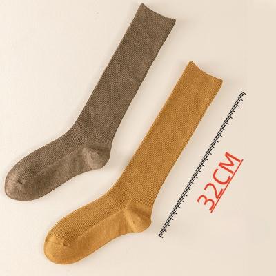 China Winter warm socks New design top quality winter warm over calf socks wholesale custom logo solid color cotton long socks for girls for sale