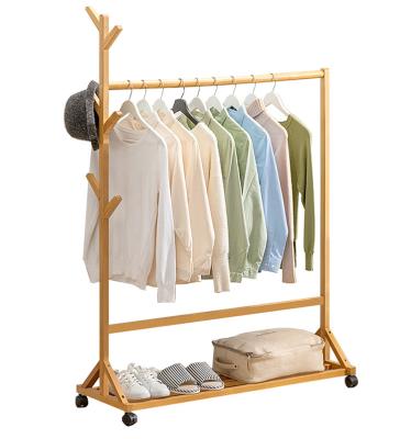 China Creative Multi-Function Artifact Multifunctional Creative Floor Storage Clothes Rack Single Bamboo Rack Coat Rack for sale