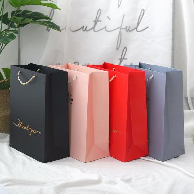 China Recycled Materials Shape Clothes Bag Art Paper Shopping Bag Coffee Goods Bag for sale