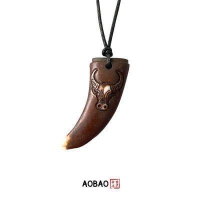 China Non Tarnish Aobao Resin Wolf Tooth Pendant Wax Cord Necklace Black String Cow Horn Pendant Necklace for sale