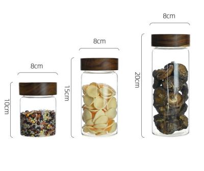 China Freshness Preservation Glass Storage Jar Coffee Bean Kitchen Food Container With High Grade Natural Acacia Lid for sale