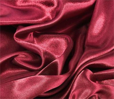 China Anti-Static 100% Polyester Satin Microfiber Peachskin Ideal Shorts Fabric And Coat Fabric for sale