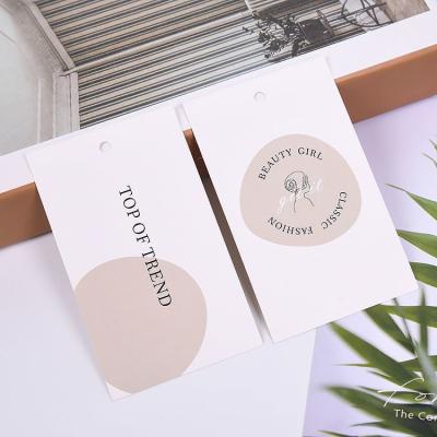 China Sustainable Personalized Custom Printing Garment Clothing Paper Hang Tags for sale