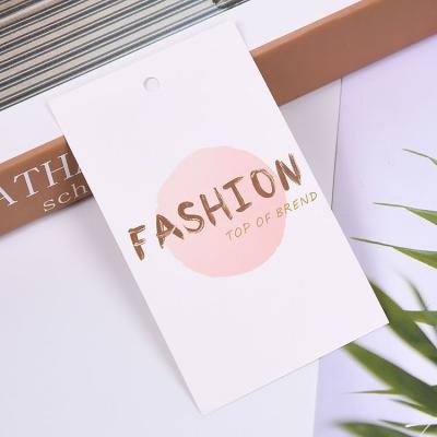 China Sustainable Custom Garment Printed Paper Tag Designs Card Clothing Tag for sale