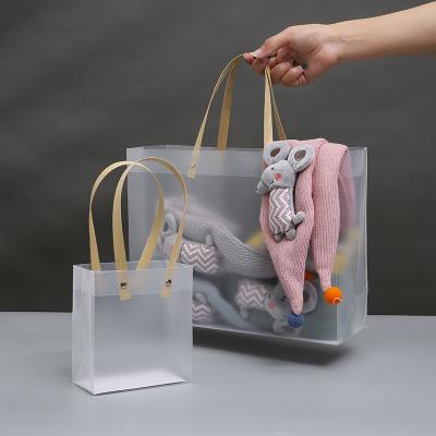 China Fashion\Comfortable\Durable Wholesale Transparent PVC Tote Shopping Bag For Large Capacity Handbags Handles Wedding Gifts for sale